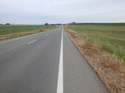 The road ahead, mostly plains with farm land.